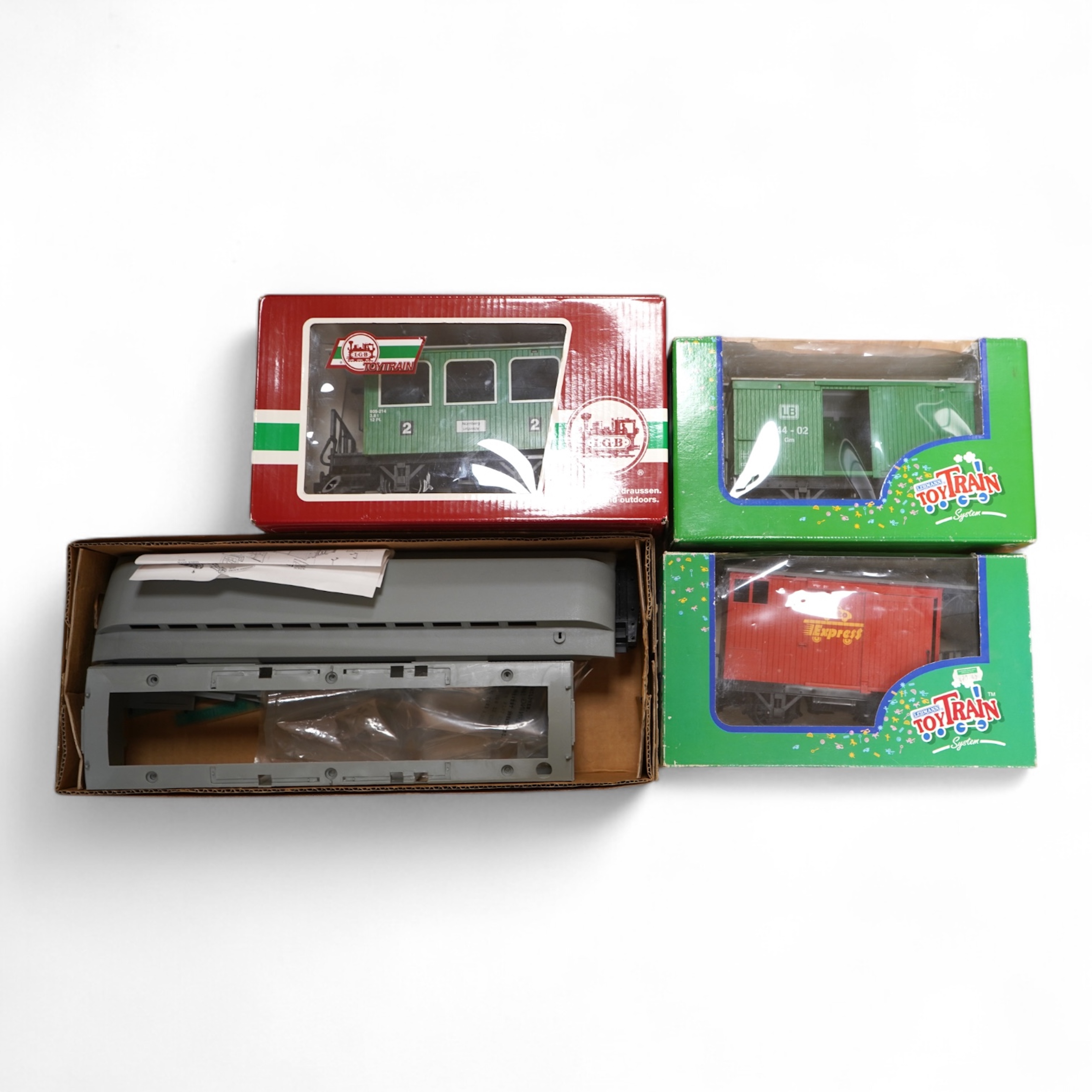 Four Lehmann and Bachmann G scale (45mm gauge) freight wagons; an unconstructed Bachmann Big Haulers G Kits 4-door Baggage Car (98910), an LGB 4-wheel coach in associated box, plus two others by Lehmann Toytrain in assoc